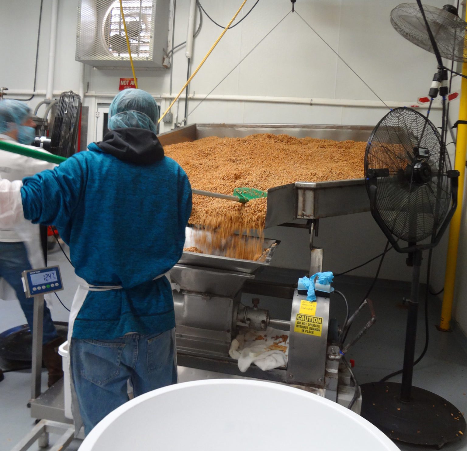 Miso Master Tour as seen on pixiespocket.com - An employee moves the soybeans used to create the miso paste.