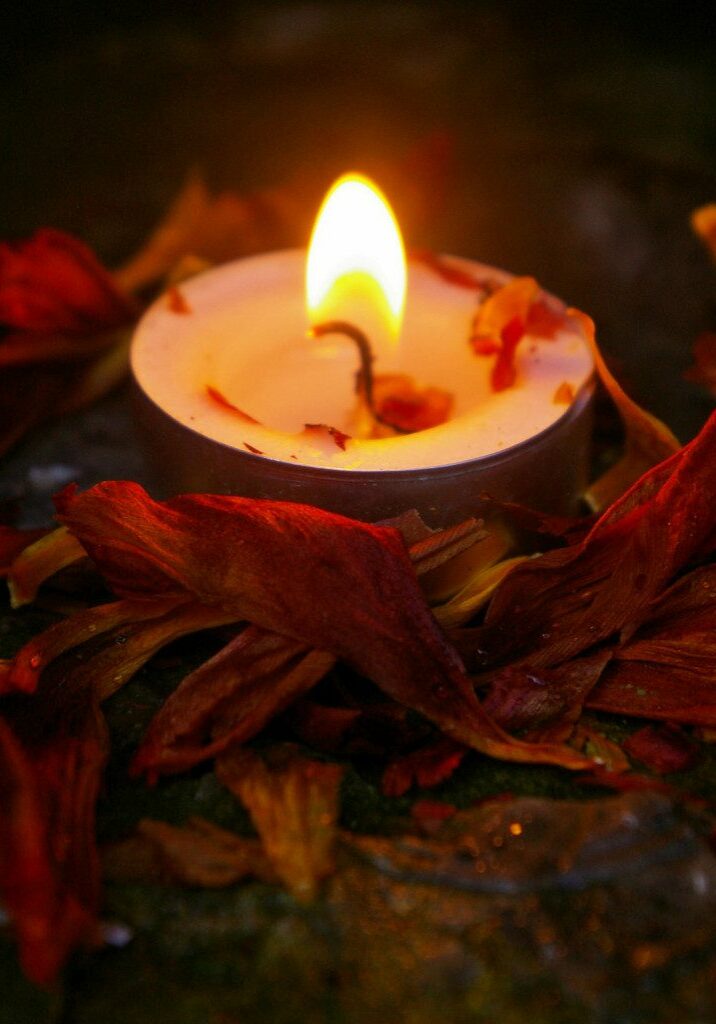 a lovely candle, surrounded by tons of tiny, flammable herbs waiting to become wax-soaked wicks! (Candle safety on pixiespocket.com)